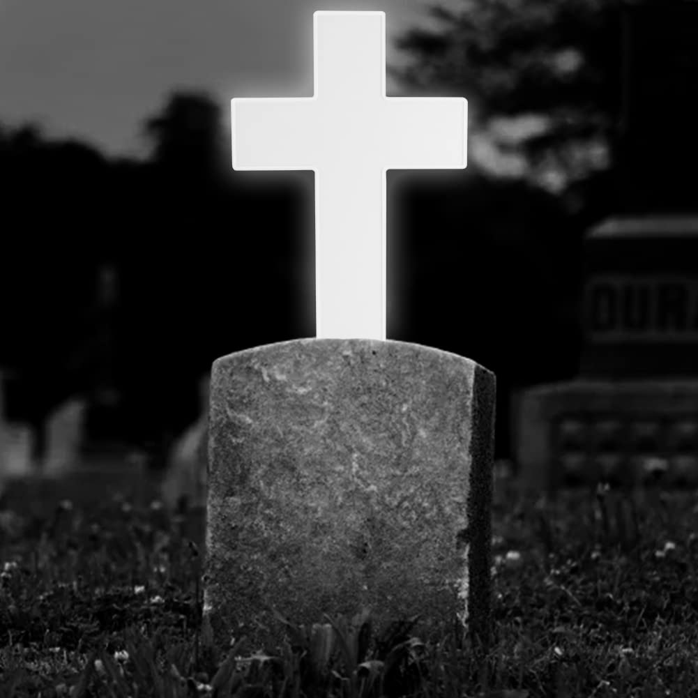 NINEFOX illuminated cross at night casting gentle light for a peaceful memorial ambiance
