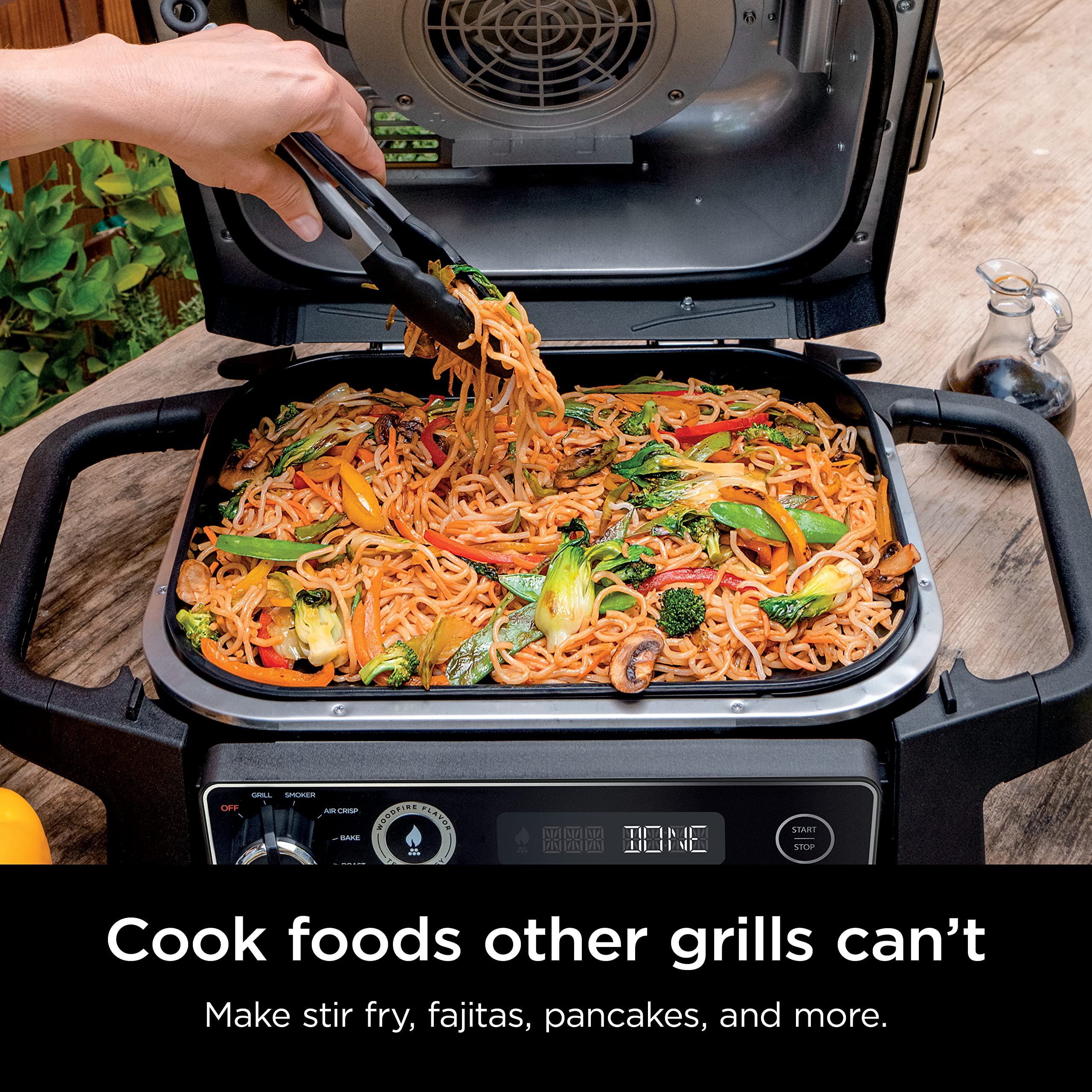 Ninja griddle clicked into OG700 grill demonstrating secure fit and even edge-to-edge heat