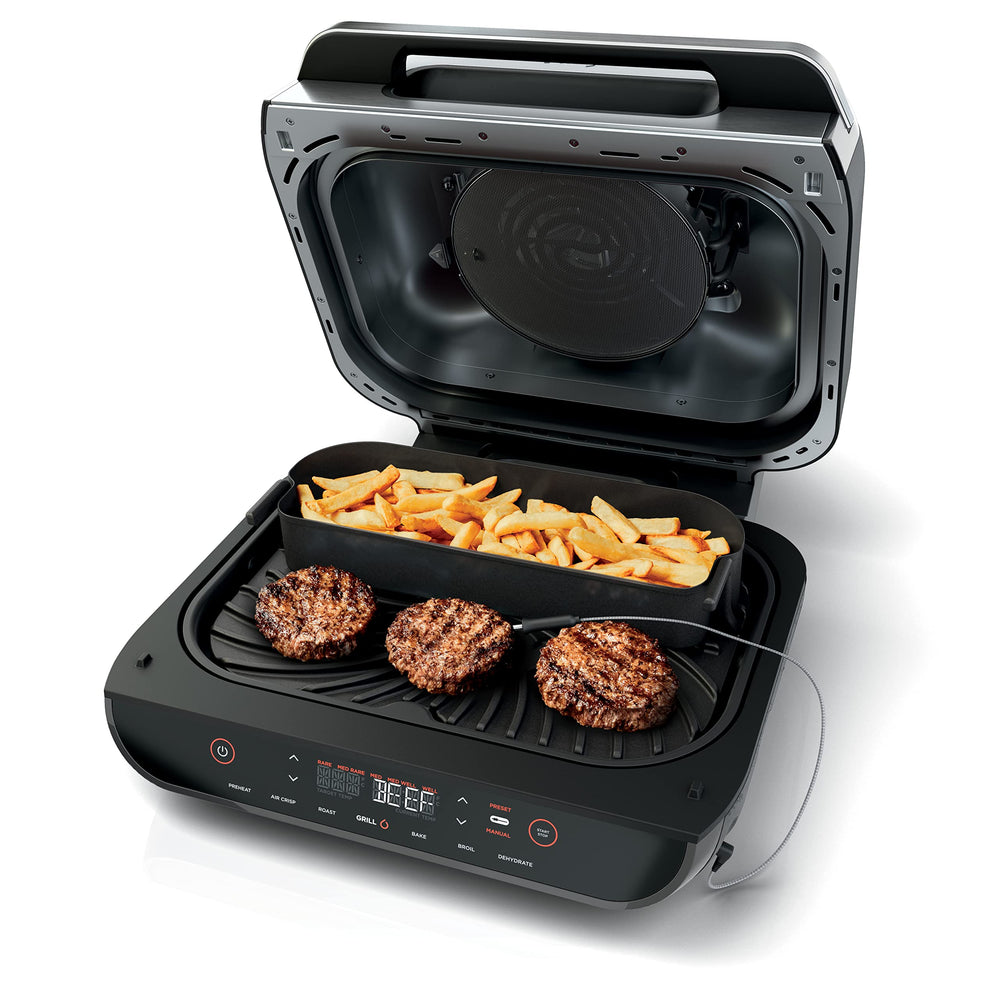 Ninja crisper basket in grill demonstrating simultaneous mains and sides cooking benefit