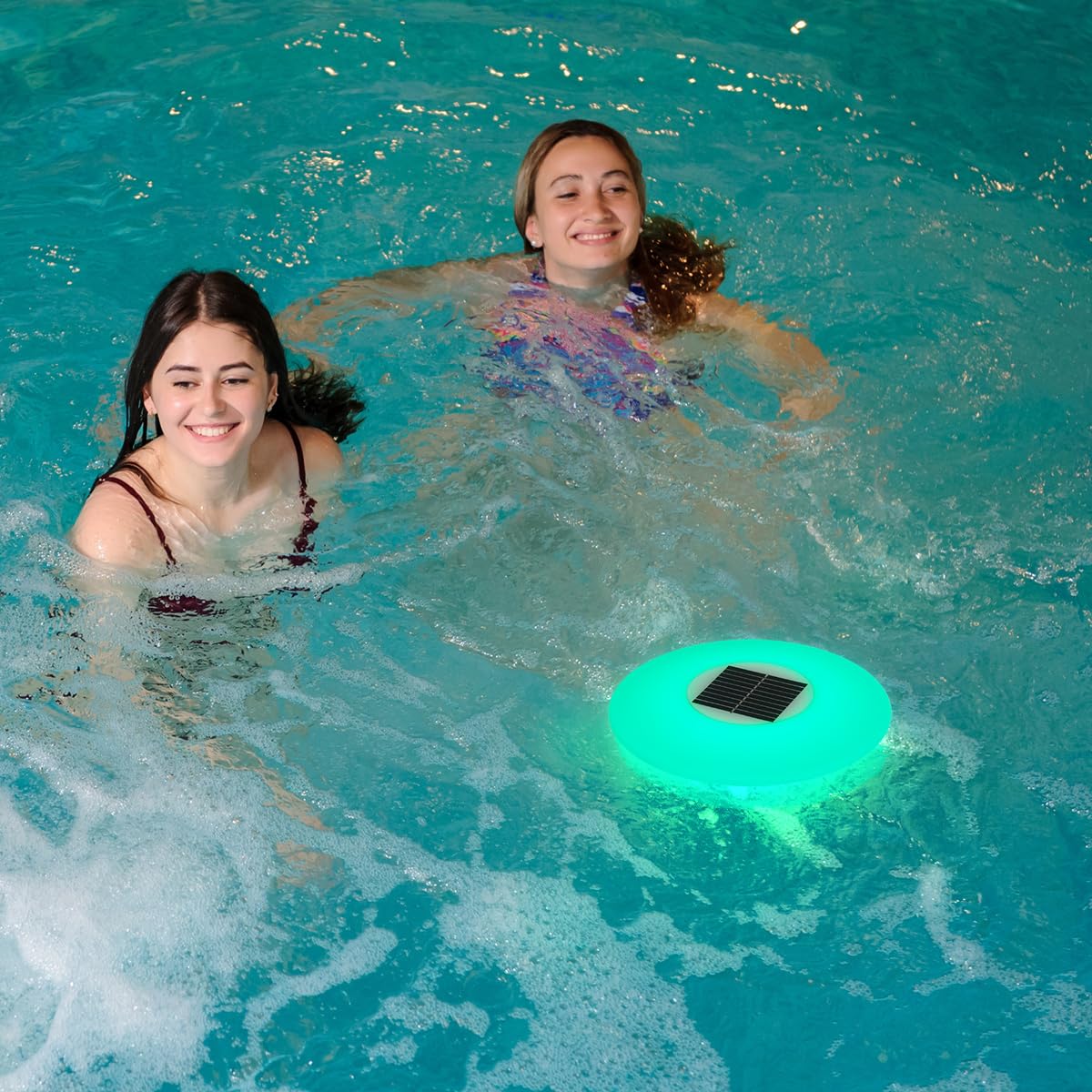NORTTA lights floating on pool at night creating colorful ambiance