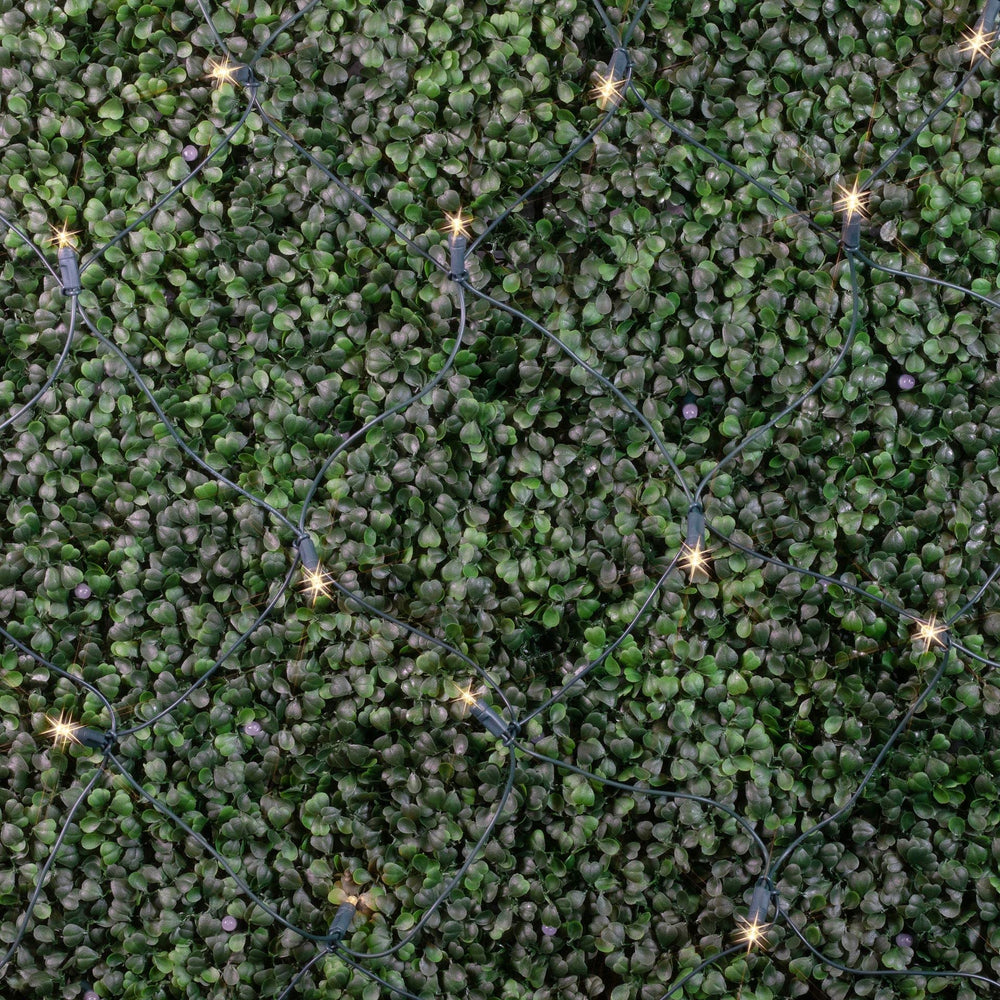 Novelty Lights net draped over a garden hedge showing even coverage and an instant holiday look
