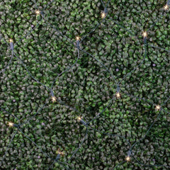 Novelty Lights net draped over a garden hedge showing even coverage and an instant holiday look