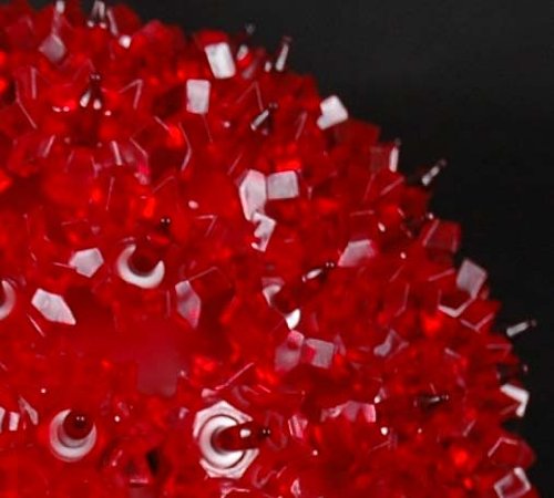 Novelty Lights nighttime lawn display creating festive red ambiance for yards