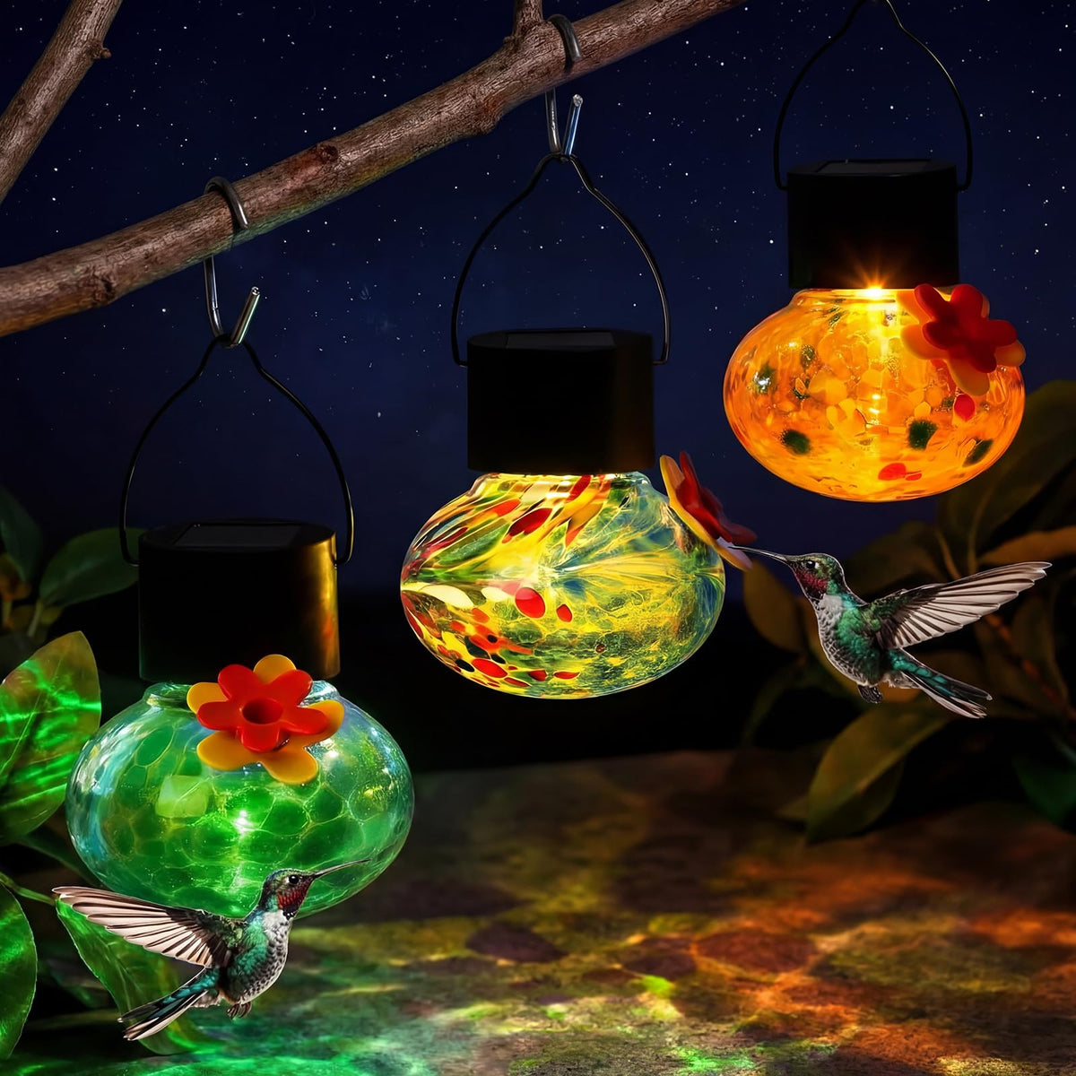 Nuogo front view of three colorful blown glass feeders showing vibrant design and appeal