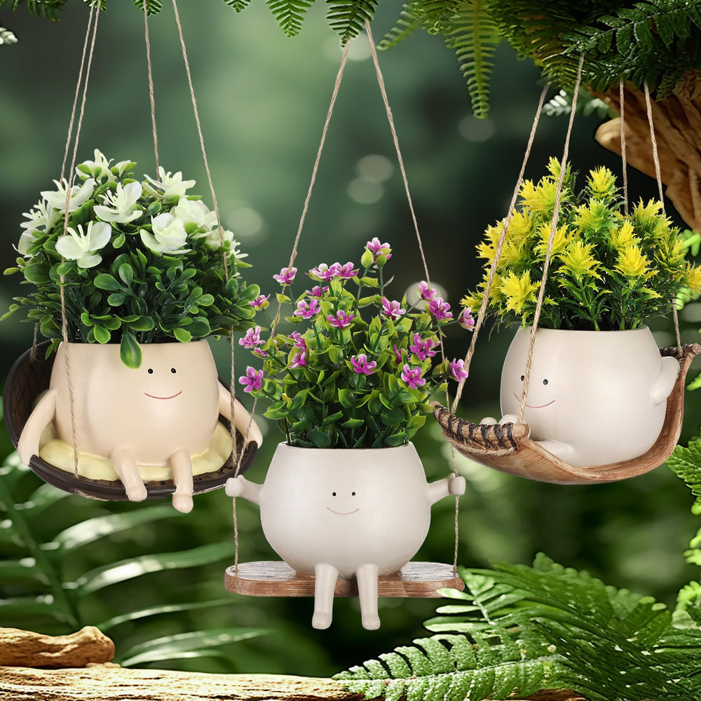 Nuogo front view three-pack hanging face planters shows playful decor
