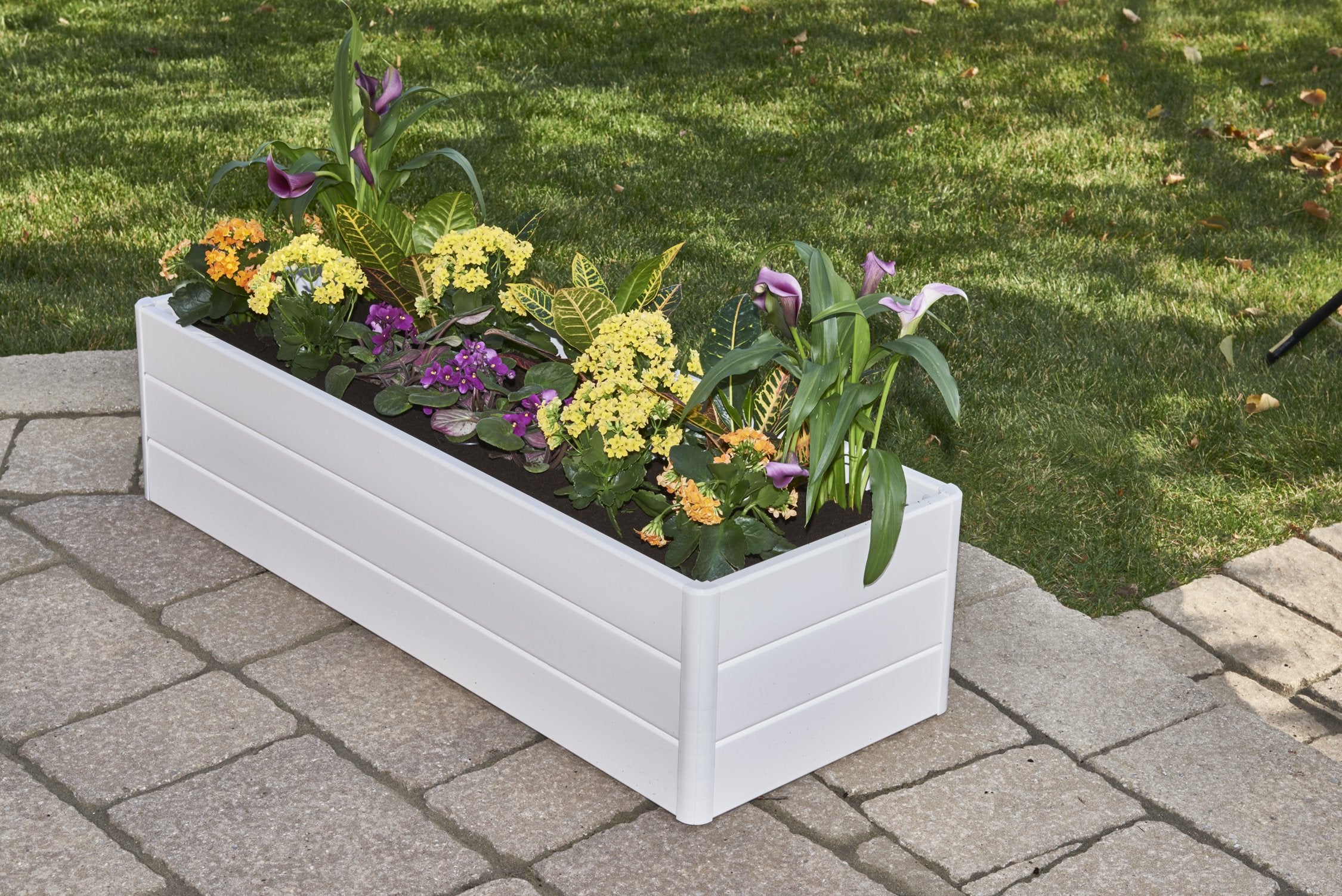 NuVue raised planter in use with herbs and vegetables demonstrating convenient elevated gardening