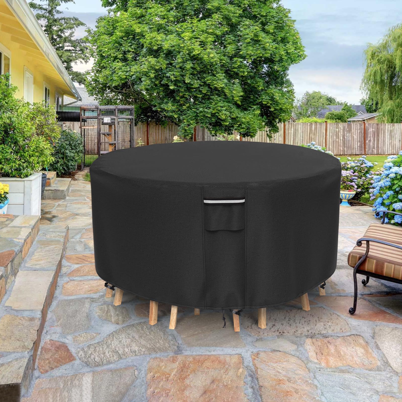 NYFITY covered table with chairs in backyard, conveys all-season protection