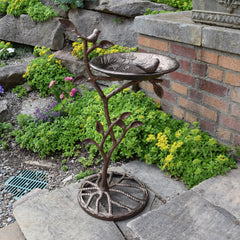Oakland Living bird bath placed in garden attracting birds and enhancing landscape