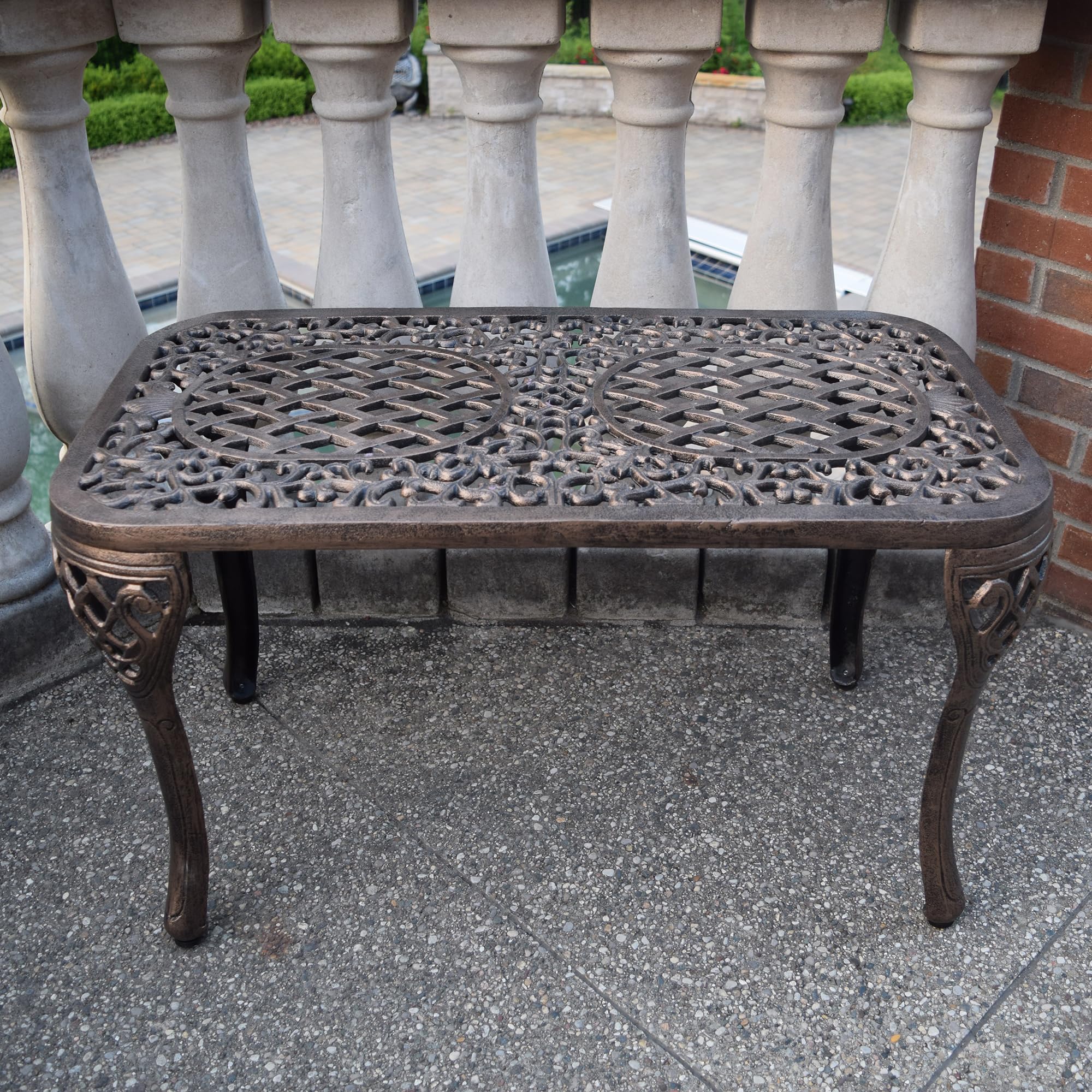 Oakland Living table beside lounge chair showing scale and compact footprint for small spaces