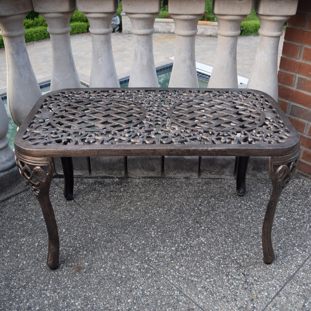 Oakland Living table beside lounge chair showing scale and compact footprint for small spaces