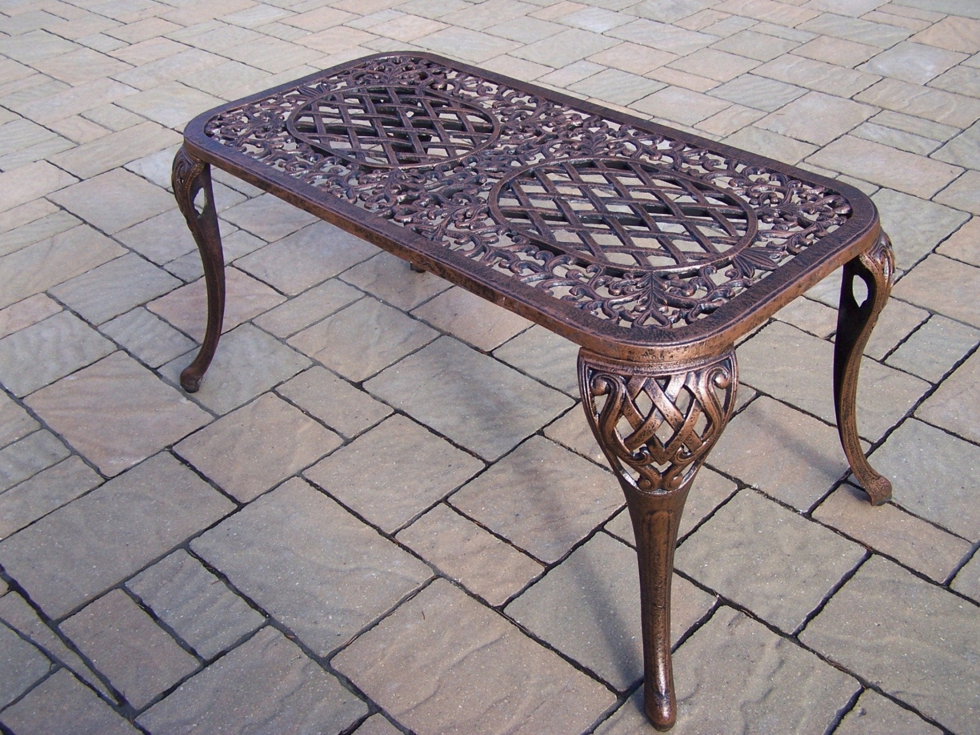 Oakland Living cocktail table in patio scene displaying usable surface and styled outdoor living