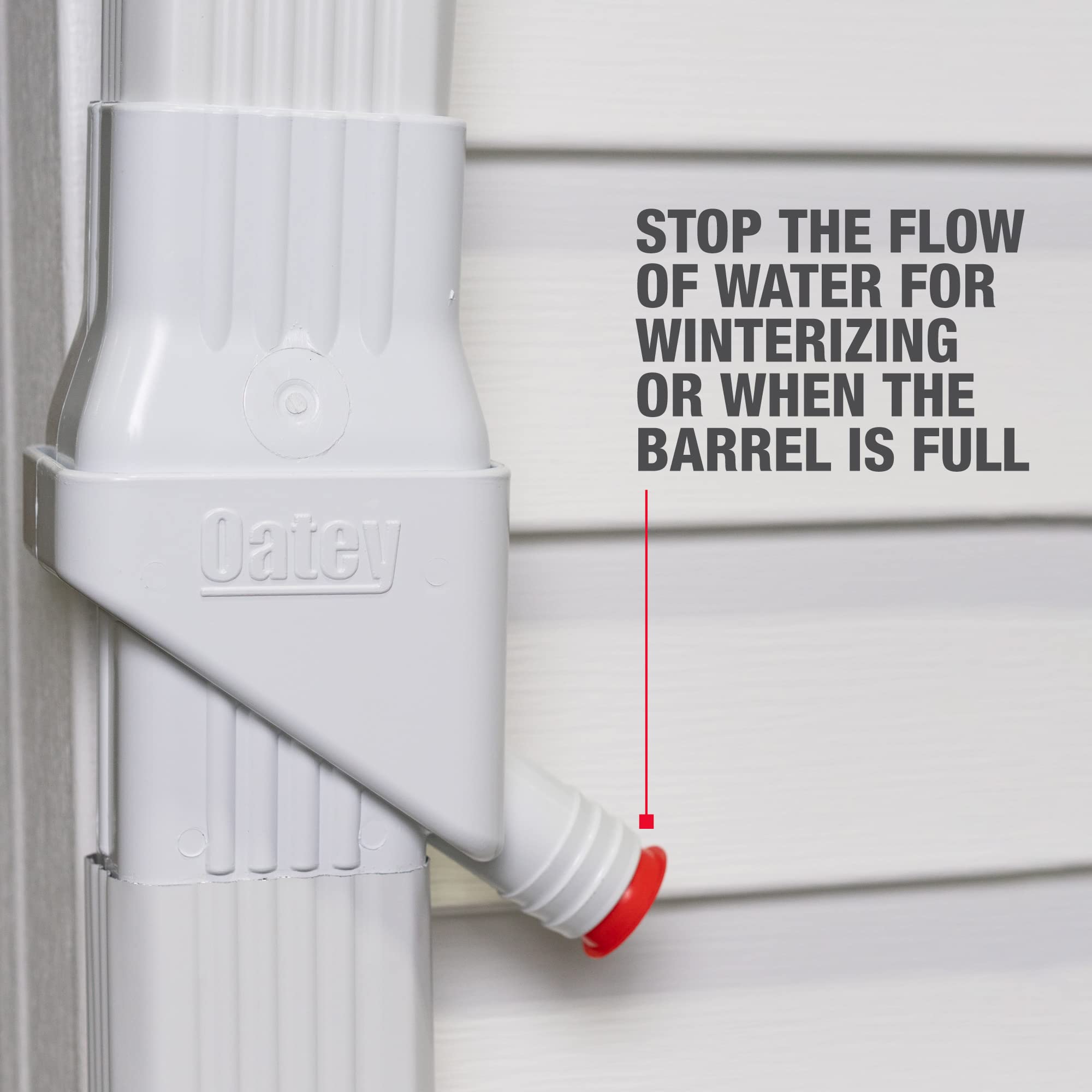 Oatey diverter installed feeding a rain barrel illustrating efficient water capture