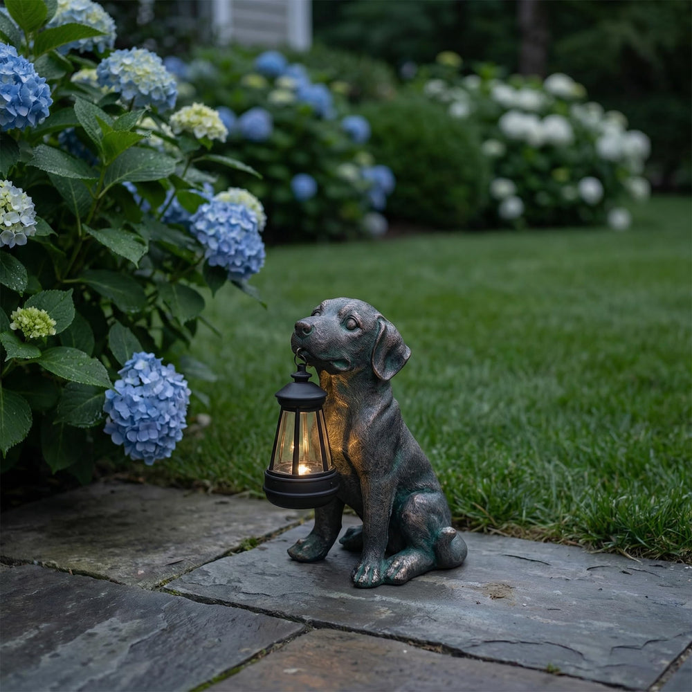 Oinas lantern illuminated at night casting soft garden light
