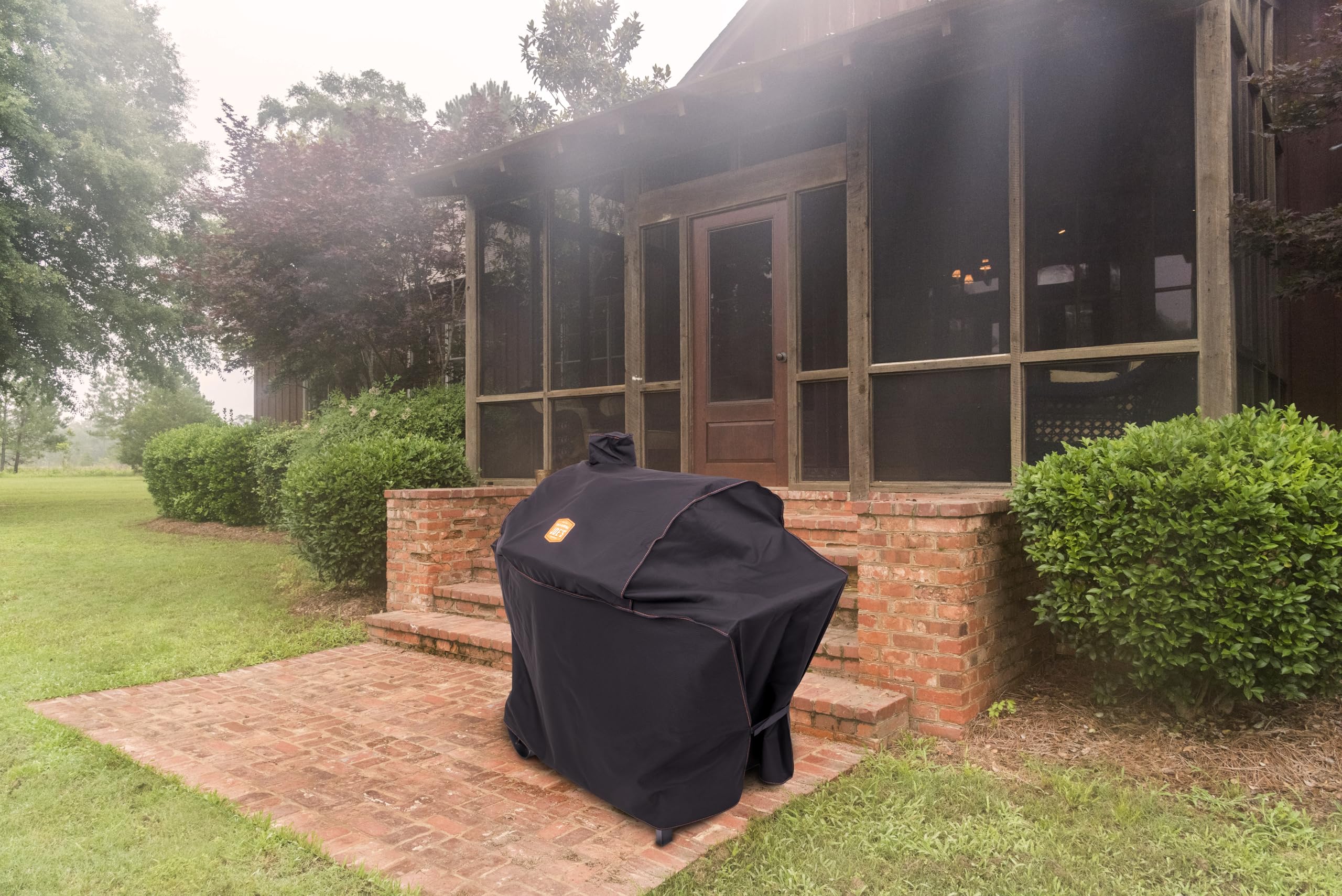 Oklahoma Joe's cover installed on Judge smoker outdoors showing weather protection
