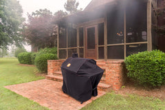 Oklahoma Joe's cover installed on Judge smoker outdoors showing weather protection