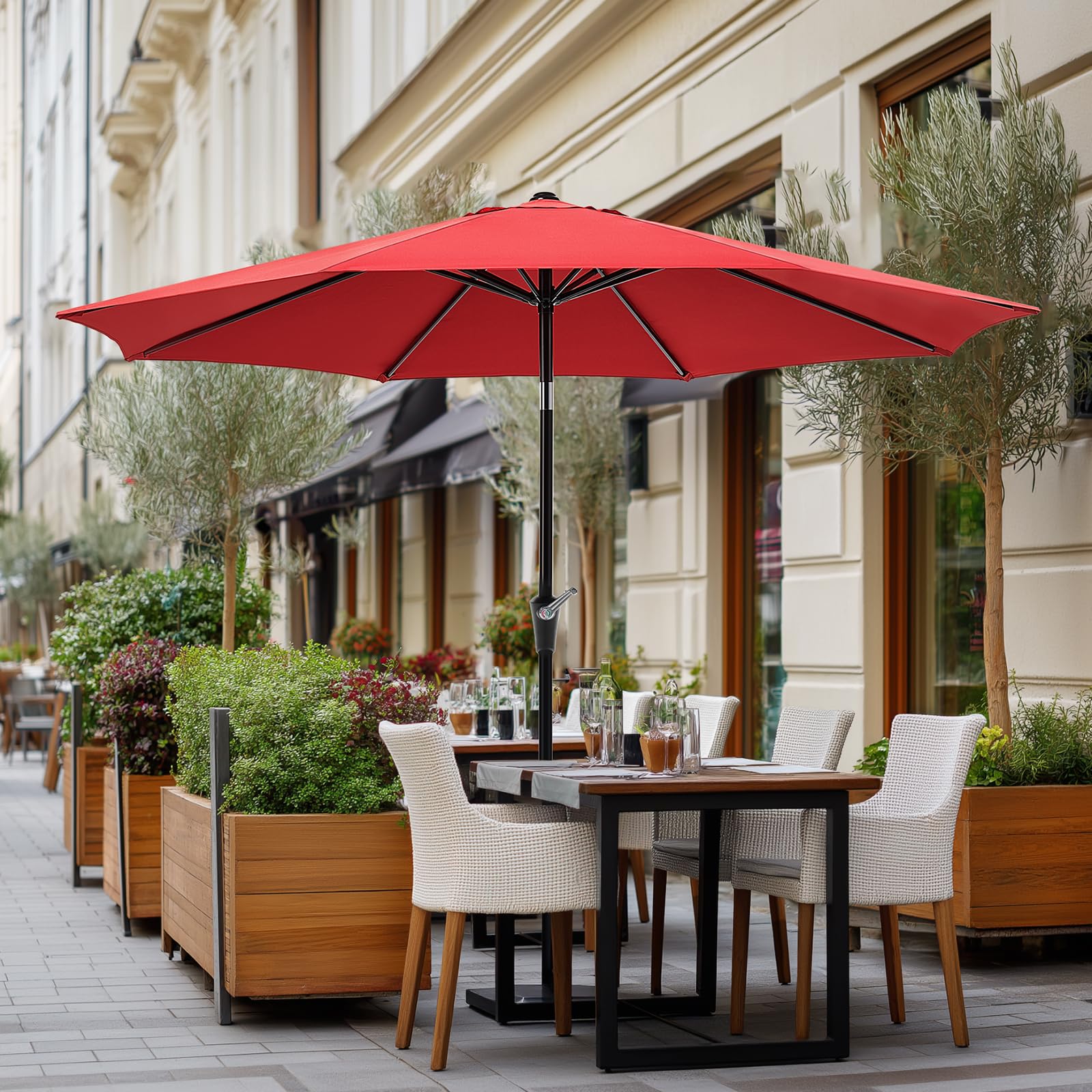 OLIXIS umbrella in use over patio table demonstrating comfortable shade