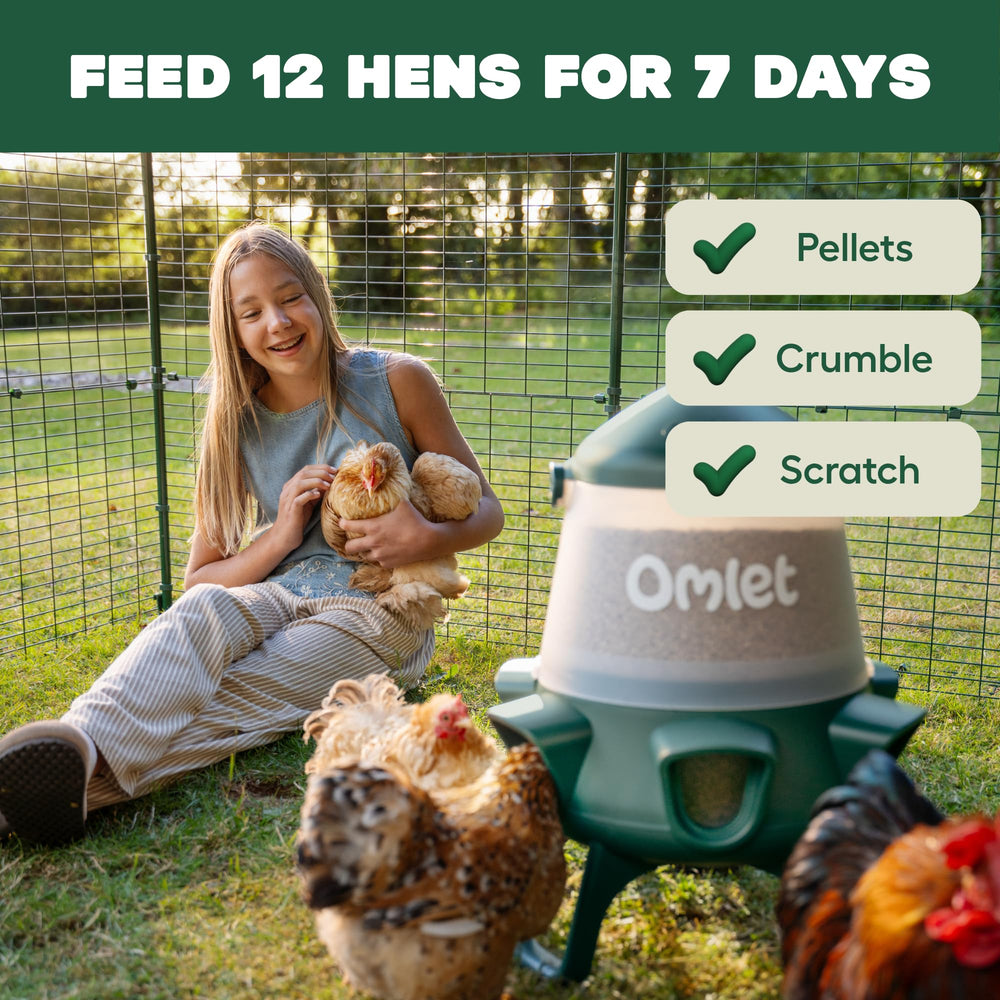 Omlet feeder hanging in a coop from a beam, saves floor space