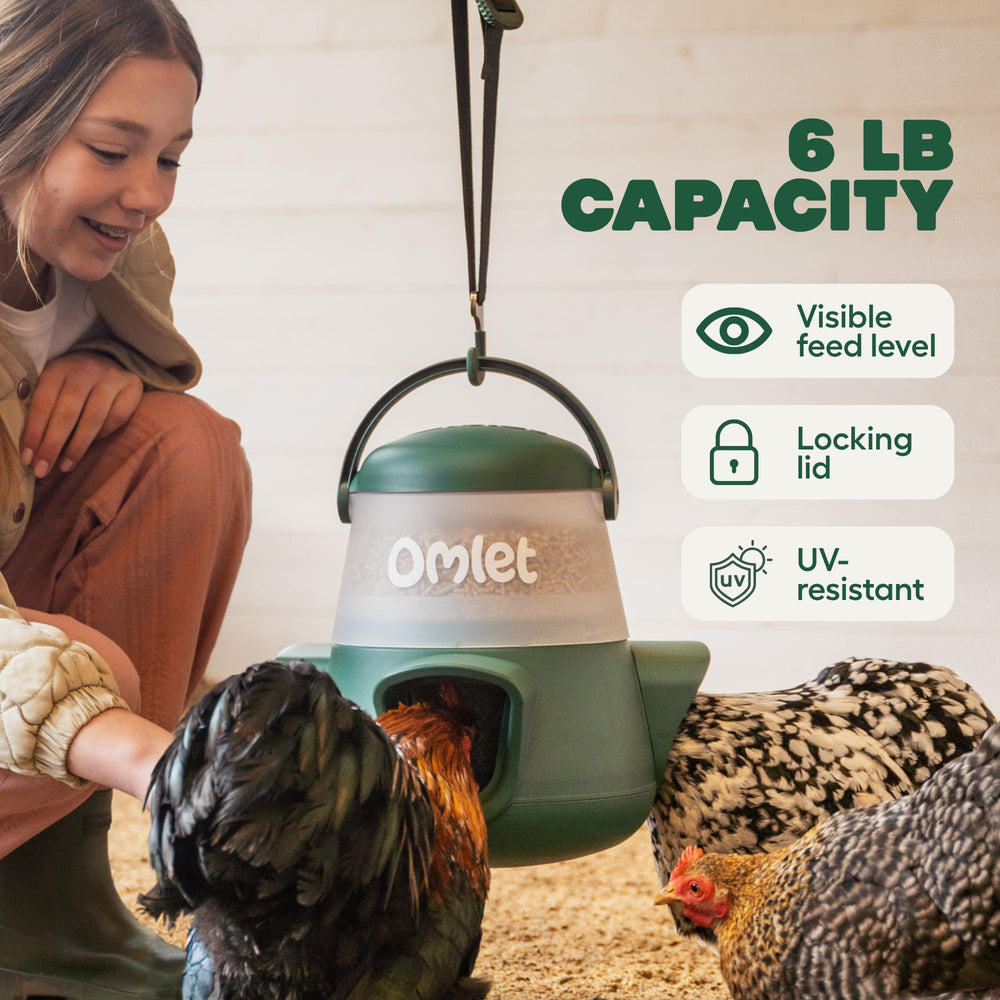 Omlet feeder hanging in coop keeps feed elevated and dry for flock
