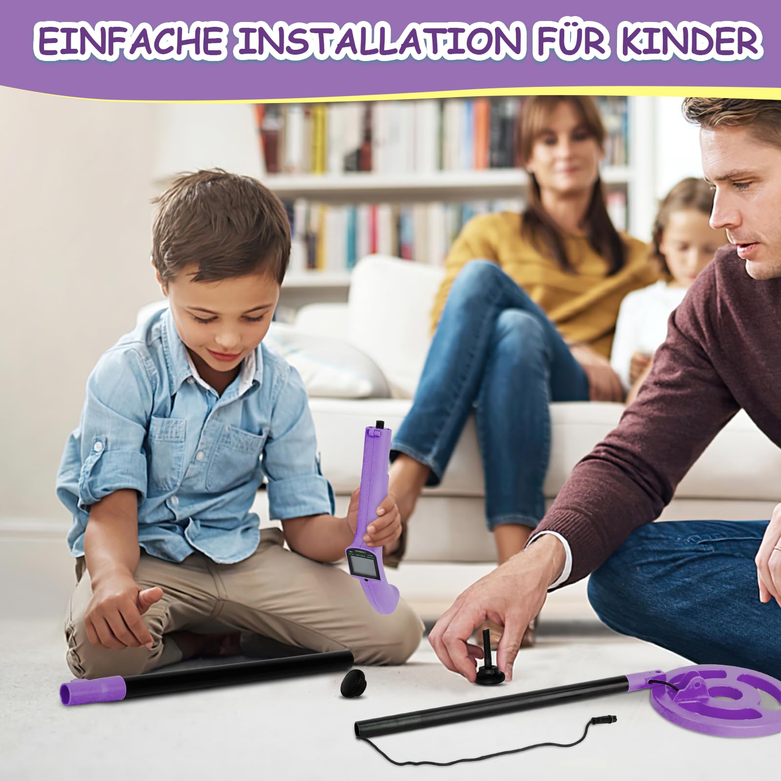 OMMO in use with child sweeping coil on beach encouraging outdoor exploration