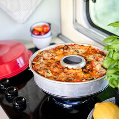 Omnia on a camp stove baking pizza benefit cook anywhere convenience