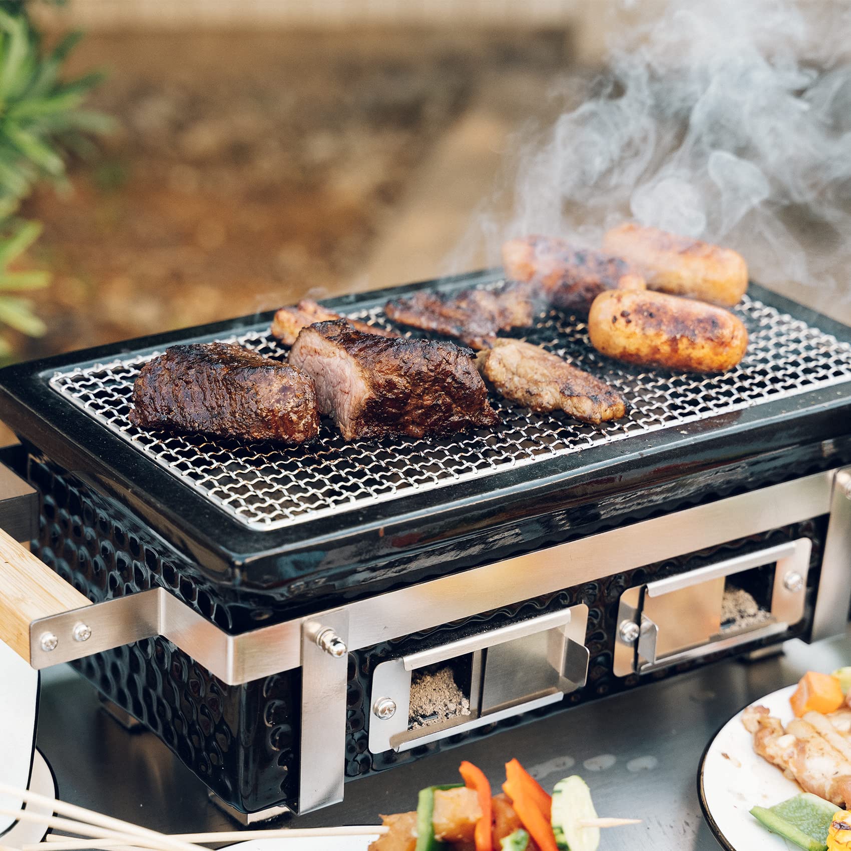 ONLYFIRE GRILLS size comparison with hands showing compact transportability