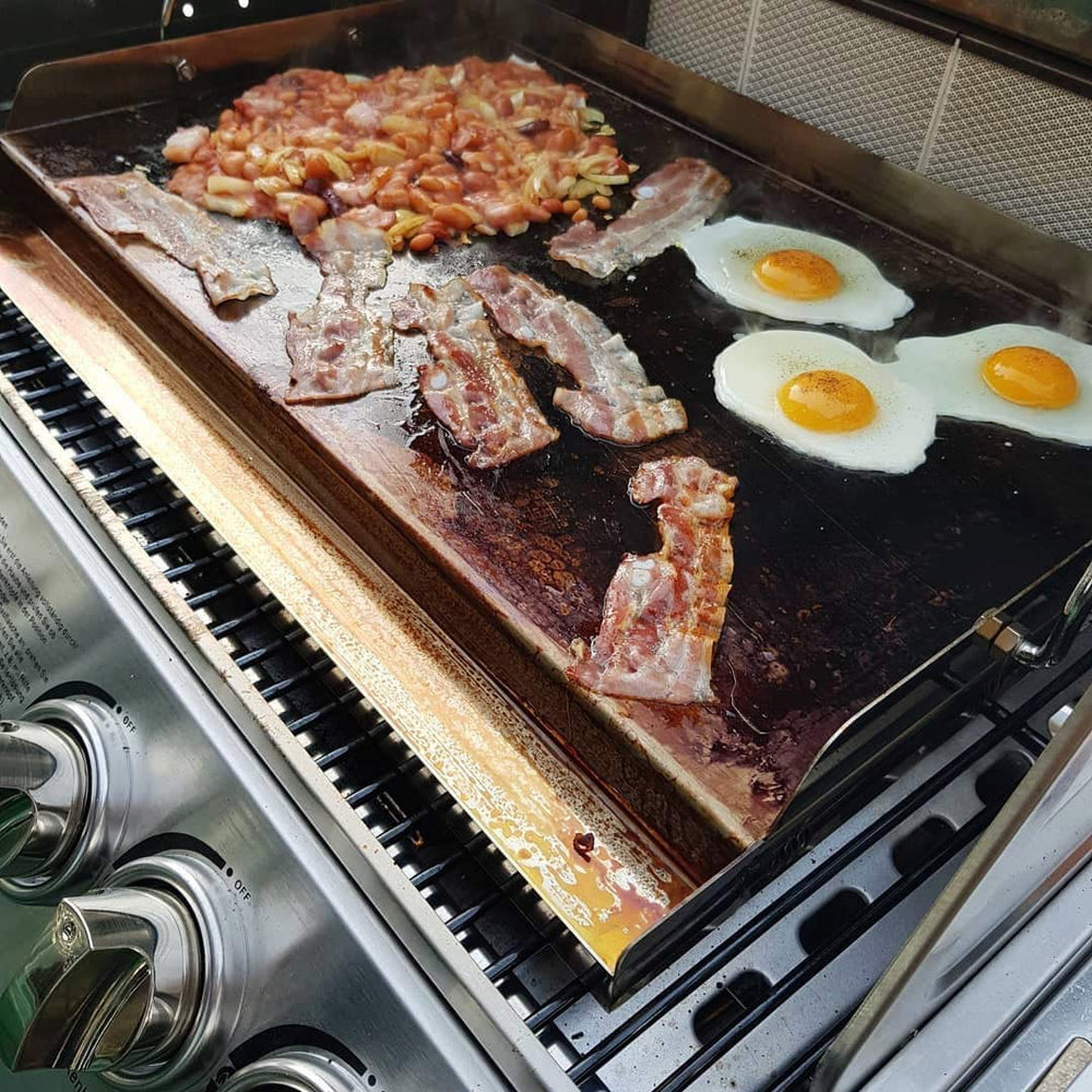 onlyfire griddle installed in a gas grill demonstrating universal fit and expanded functionality