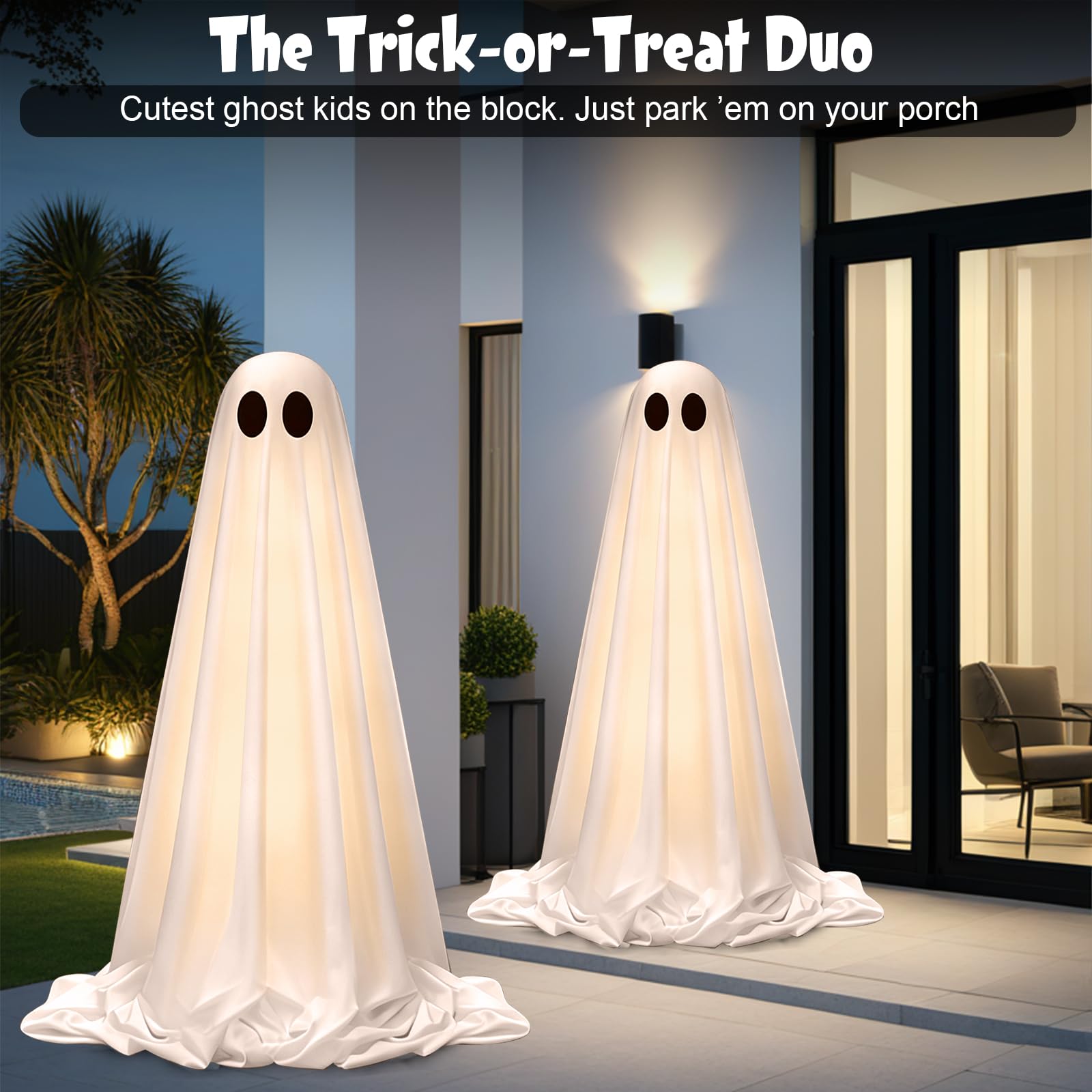 OOBILA nighttime lawn scene with light-up ghosts boosting Halloween curb appeal