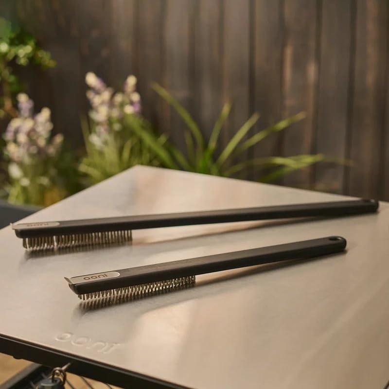 ooni brush next to a cleaned pizza stone showing restored surface