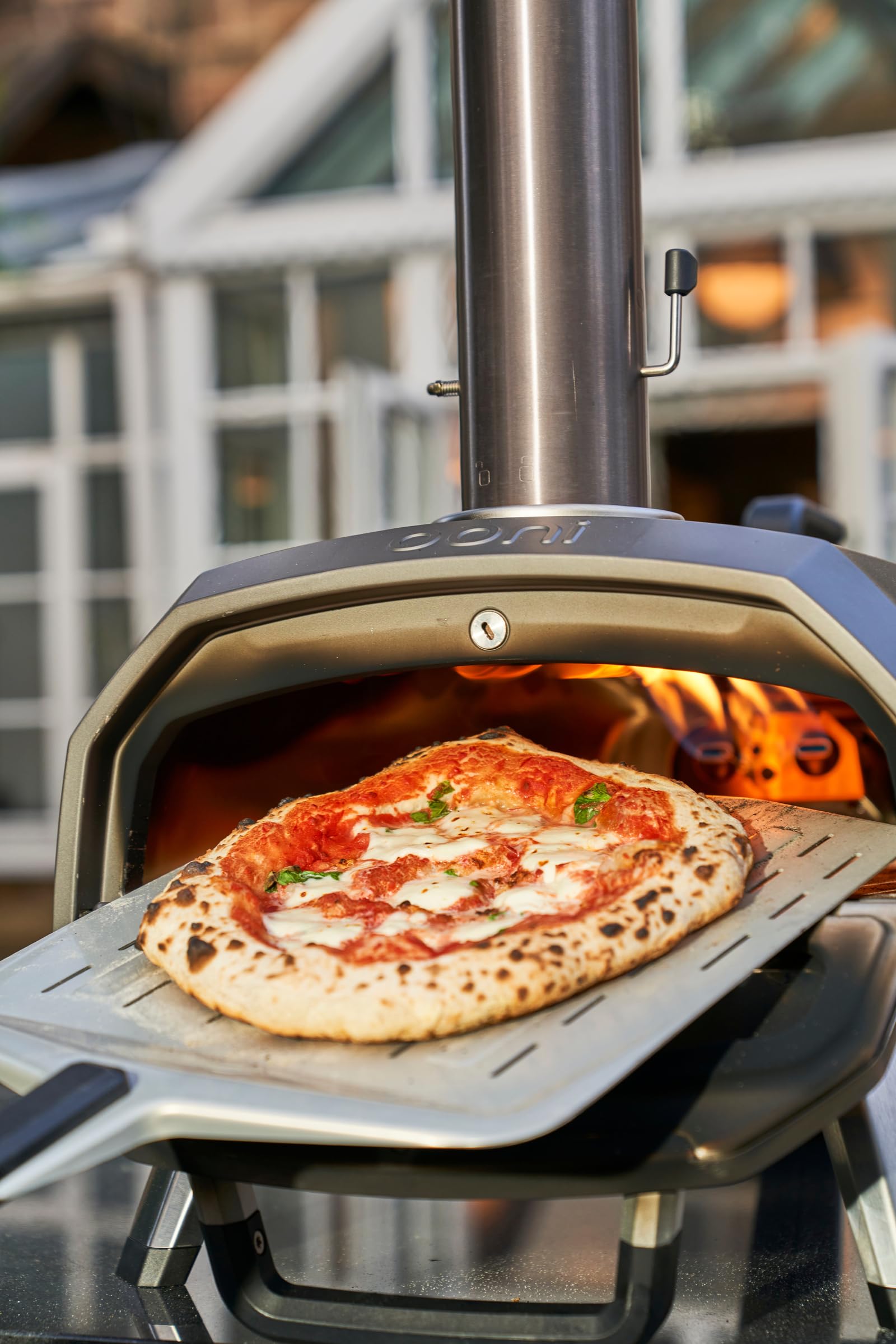 Ooni burner attached to Karu oven demonstrating easy conversion benefit
