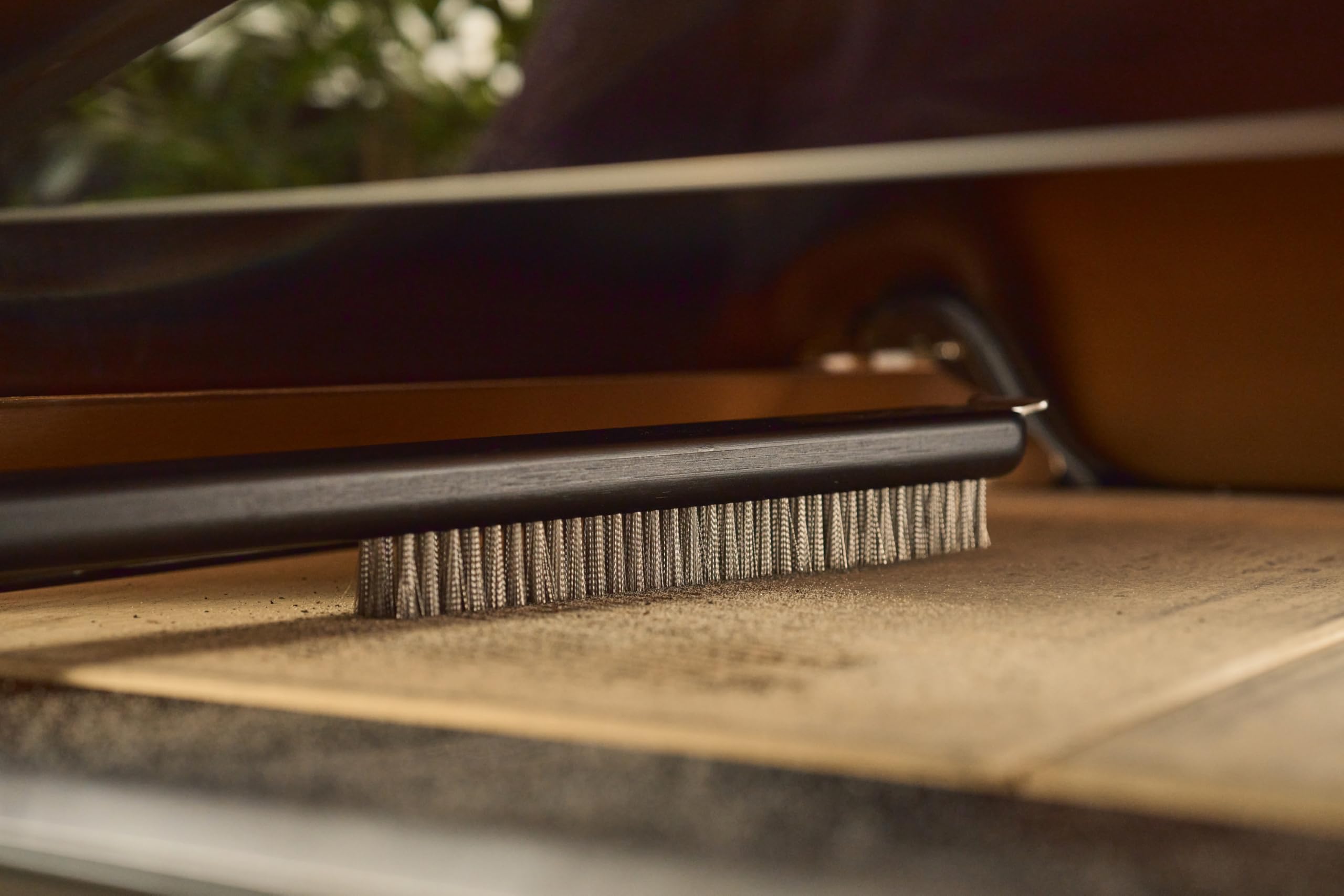 ooni tool on outdoor table by grill showing organized outdoor cooking