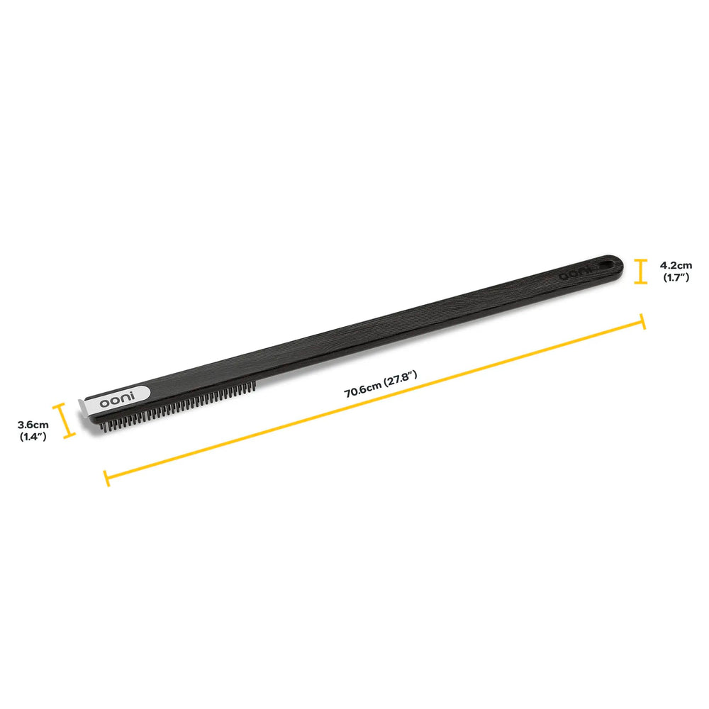 ooni long handle held next to hand showing scale and safer reach