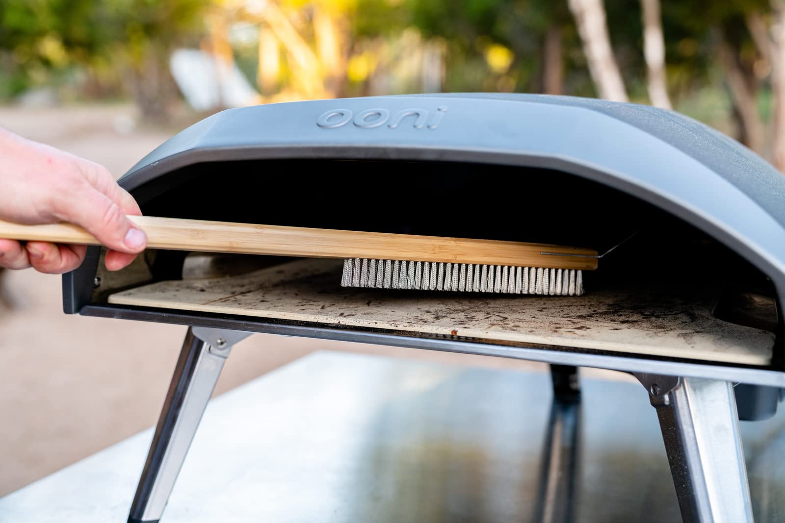 ooni pizza oven brush bristle closeup highlighting stainless steel bristles for thorough sweep