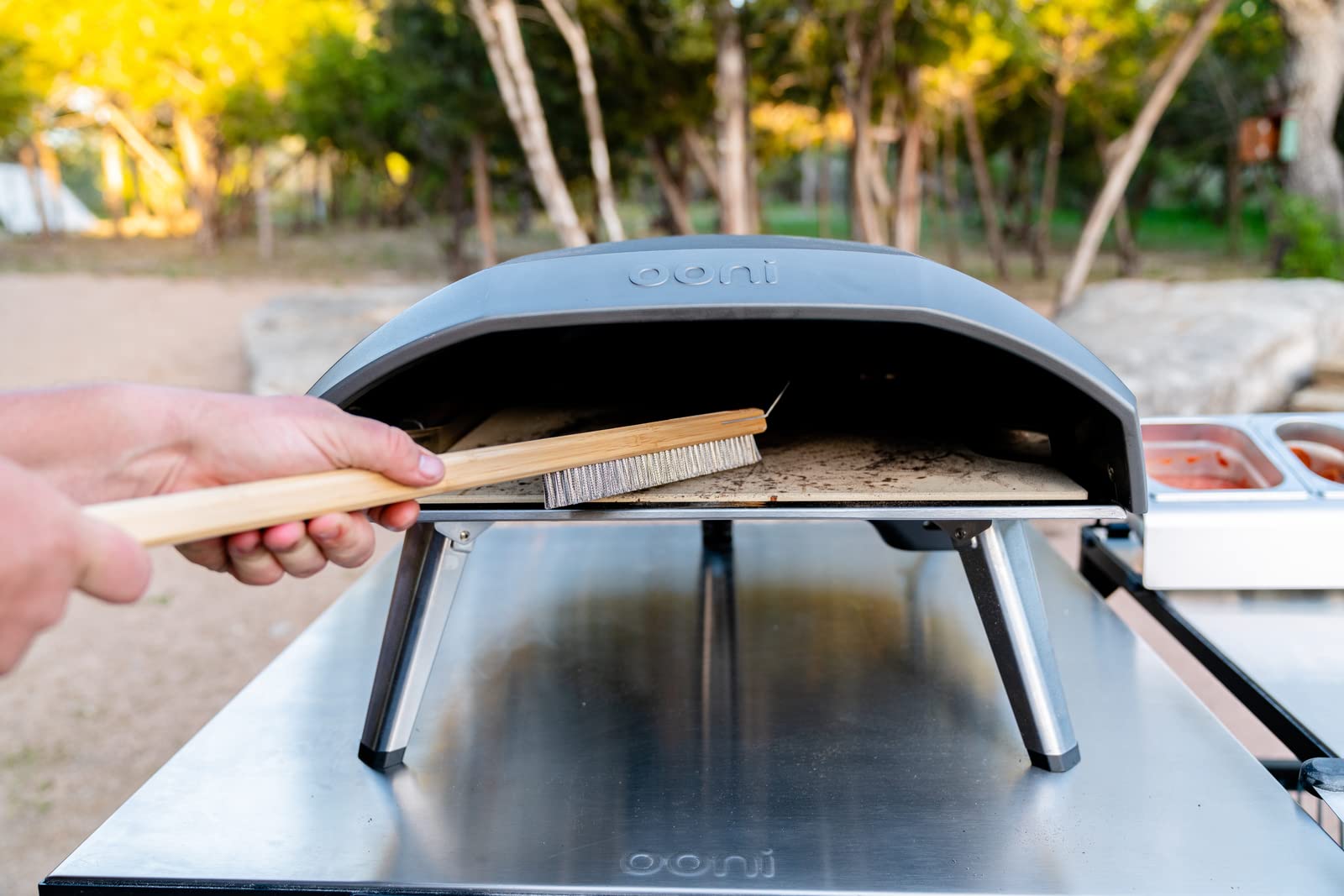 ooni pizza oven brush handle scale showing wooden handle for comfortable grip
