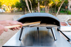 ooni pizza oven brush handle scale showing wooden handle for comfortable grip