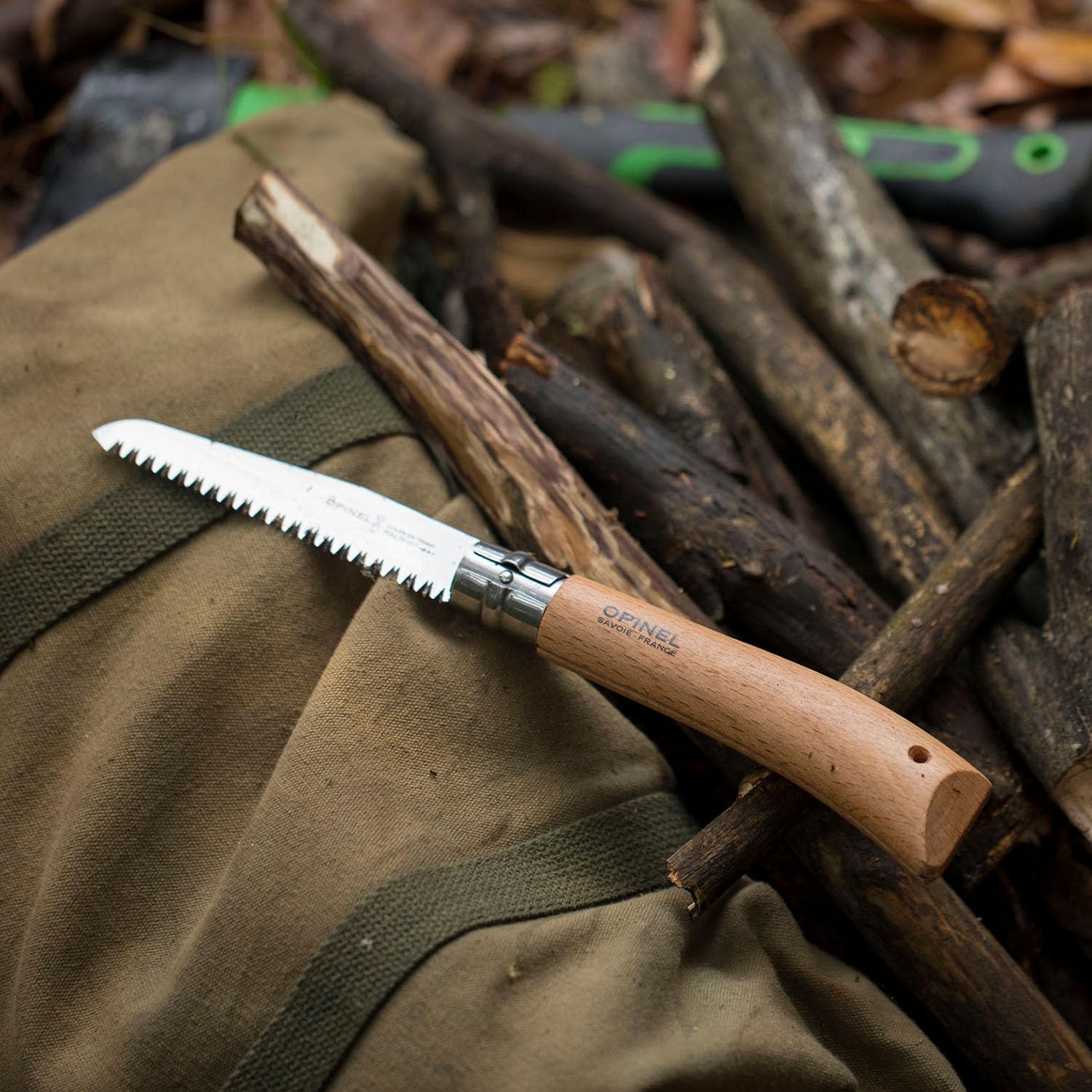 Opinel saw next to ruler for scale comparison and size convenience