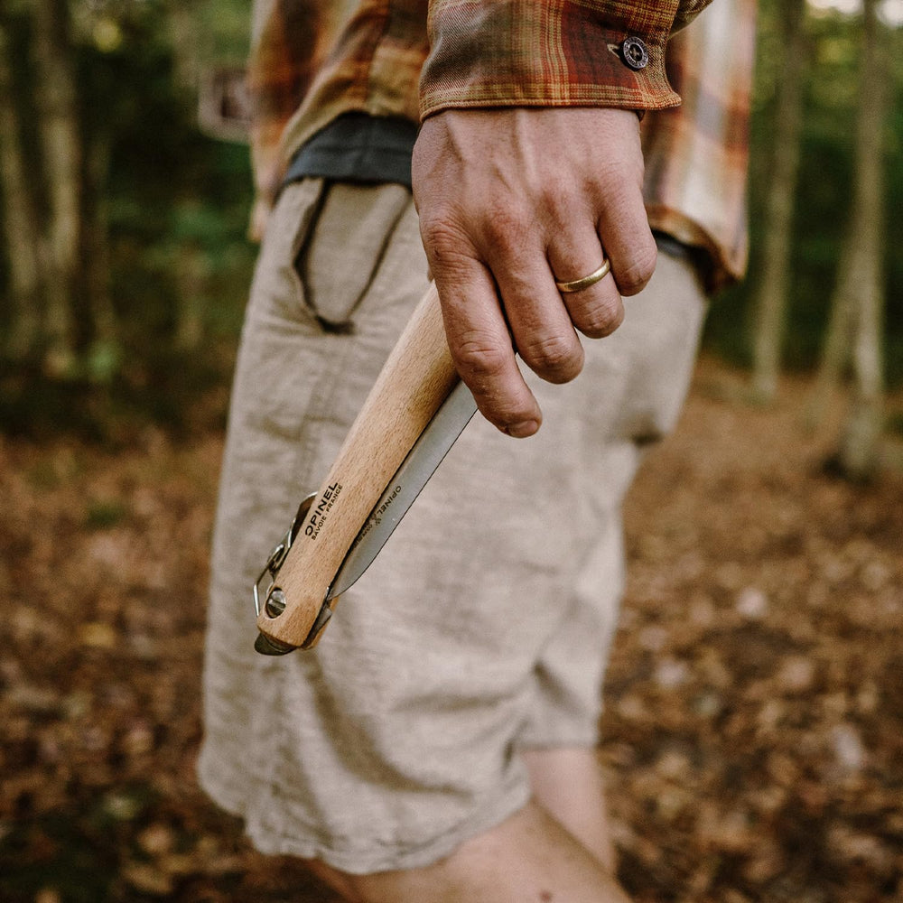 OPINEL saw next to ruler showing 7-1/8 inch blade size for scale