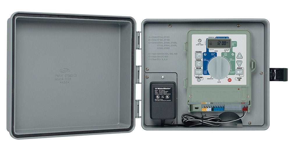 Orbit cabinet mounted on exterior wall in yard showing weather-resistant installation and discreet appearance