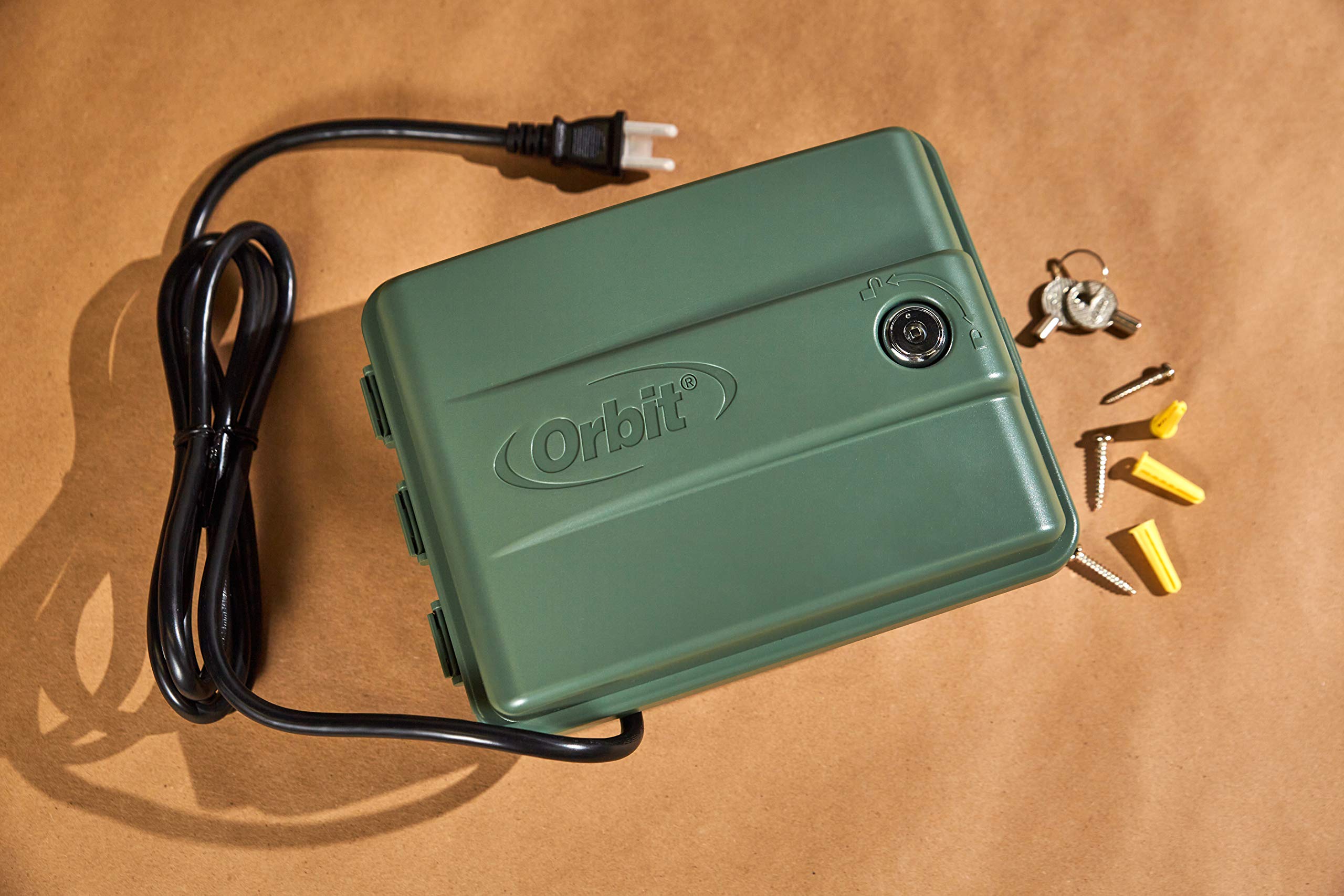 Orbit controller mounted by garden illustrating automated watering convenience
