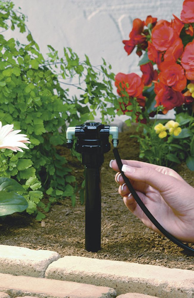 Orbit close-up of rotating 1/4" barb demonstrating easy tubing insertion and flexible positioning