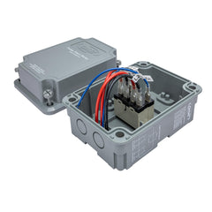 Orbit pump start relay held in hand for size scale showing compact design that fits tight irrigation boxes