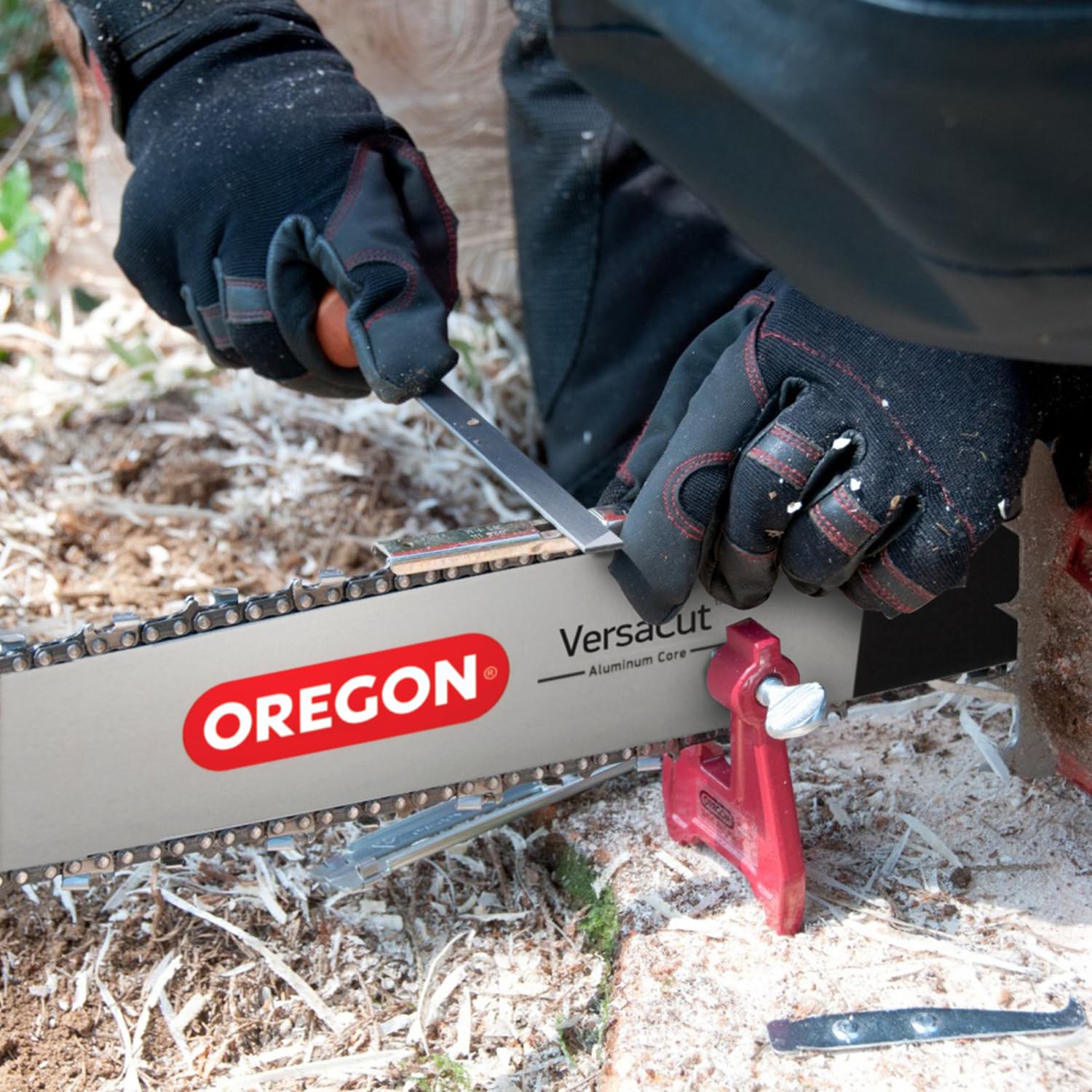Oregon felling wedge beside flat file to prevent bar pinching and true edges