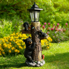 Oritty bear statue front view showing welcome sign and mushrooms, adds curb appeal