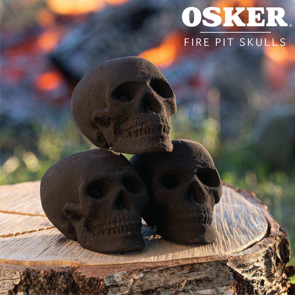 OSKER skull log next to a hand showing compact scale and portability