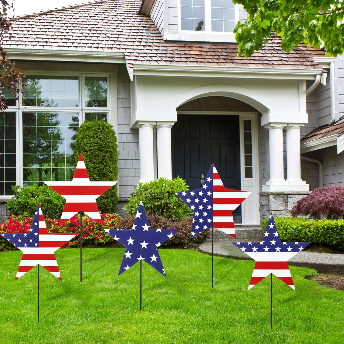 Otoolling front view of five patriotic yard signs showing variety and curb appeal