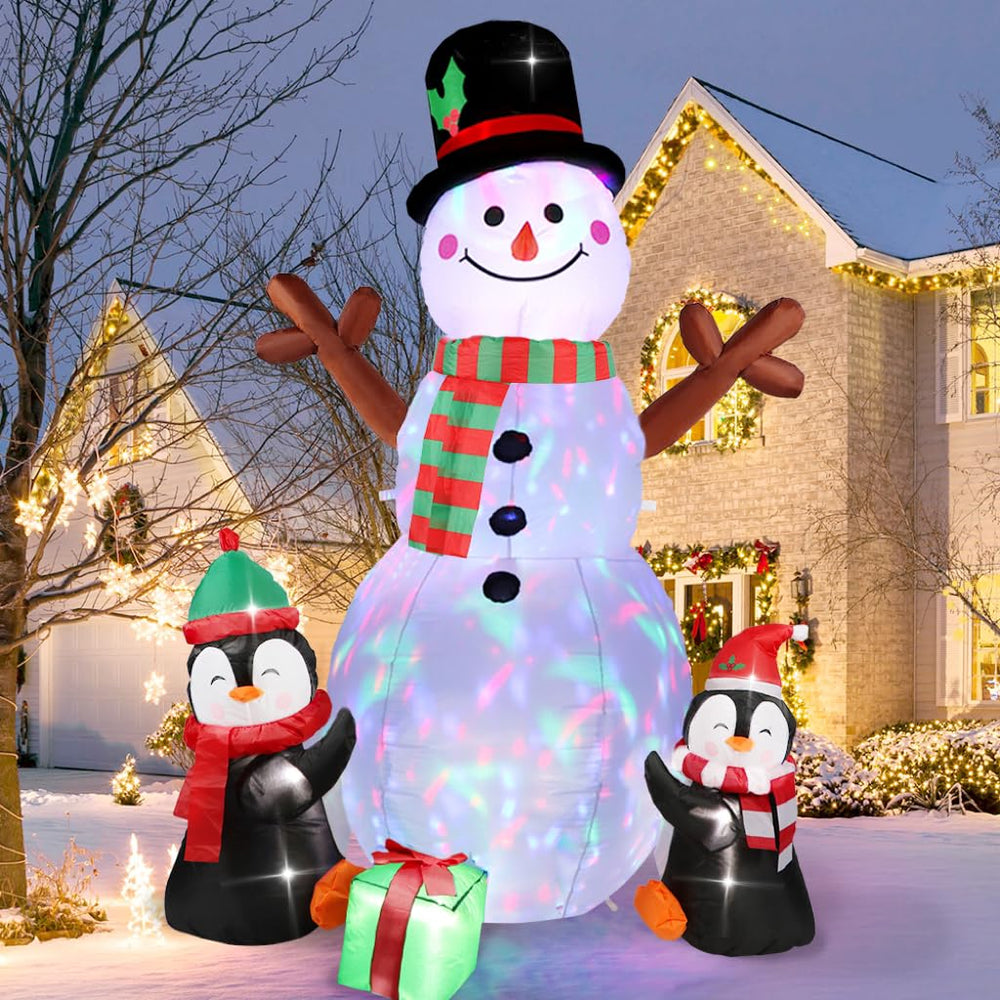 OurWarm front view of snowman and penguins, attracts guests