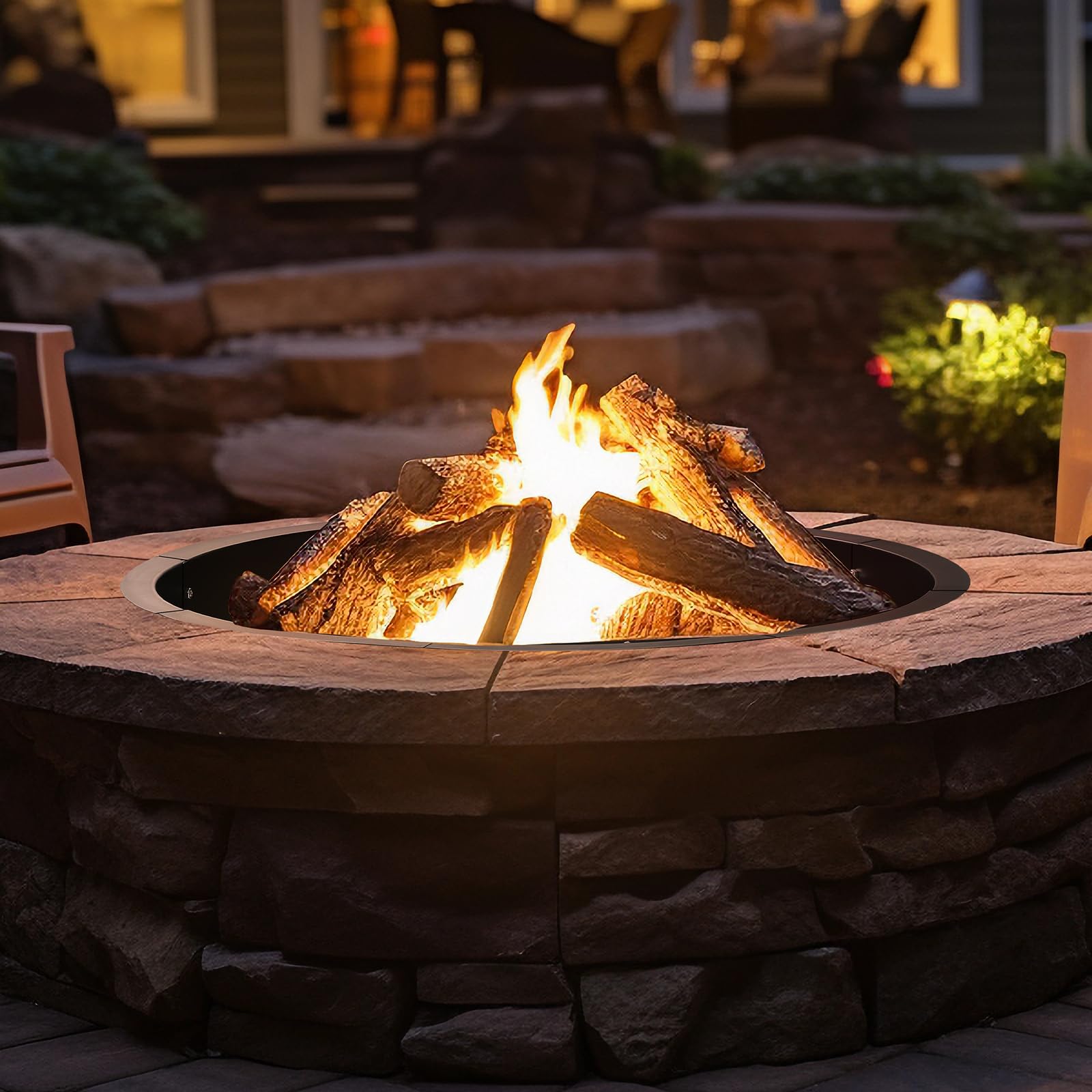 OUSHENG backyard scene of family enjoying a fire in a finished pit with the OUSHENG insert providing containment
