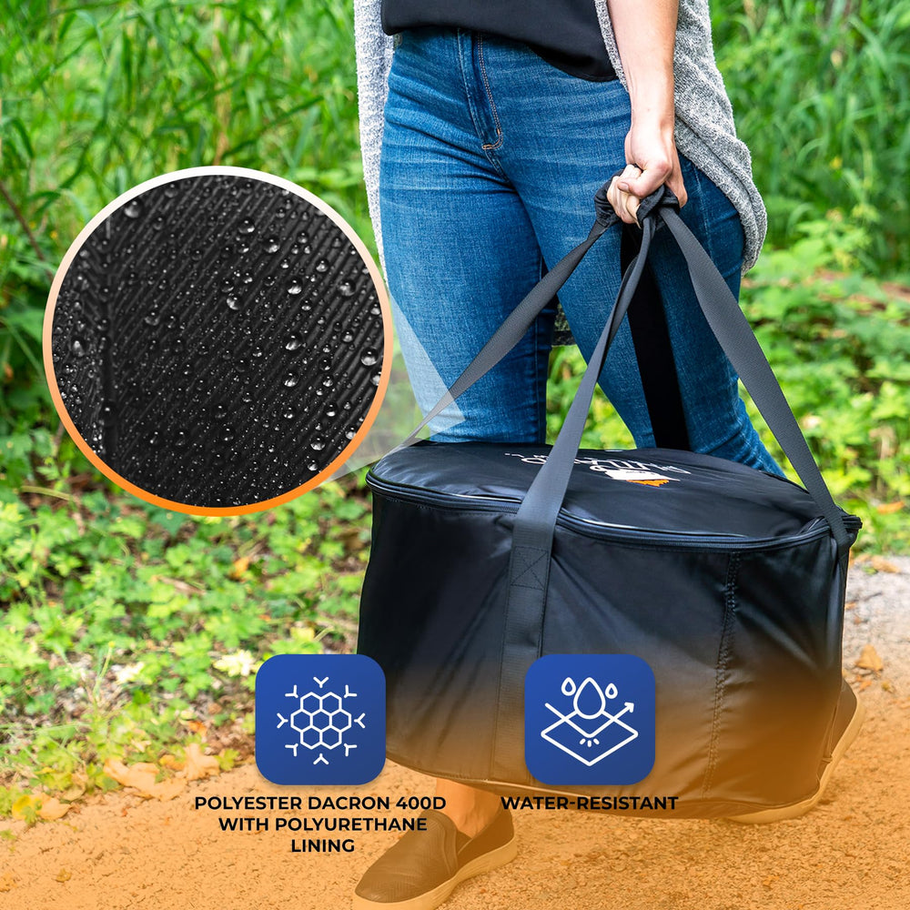Outland Living carry bag beside picnic setup, portable protection for outdoor gatherings