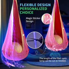 OUTREE pod swing in use with child reading to show calm focus and cozy lighting