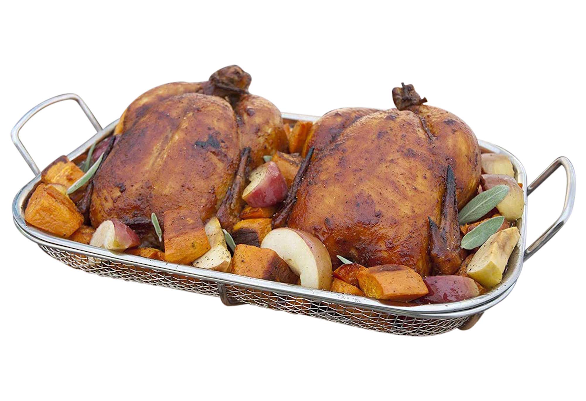 Outset basket in use on charcoal grill with vegetables for enhanced smoky results