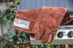 Outset gloves in use flipping burgers on a grill for confident handling